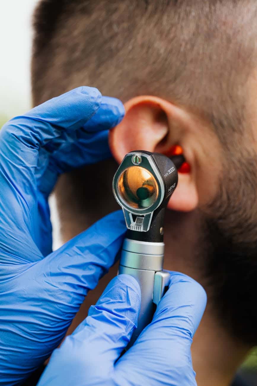 Doctor gives patient an ear exam.